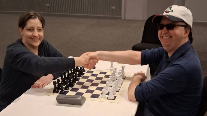 Jessica Lauser-left-playing-Black-vs-Grant-Yosenick (photo by Alexey Root)
