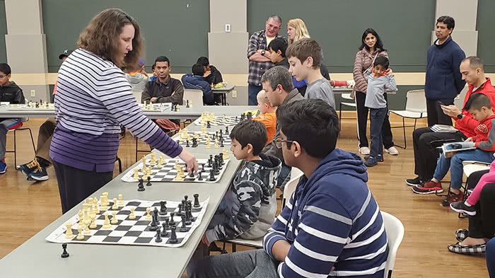 Chess master plays simultaneous exhibition against locals