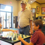 FIDE Master Keith Hayward (standing)